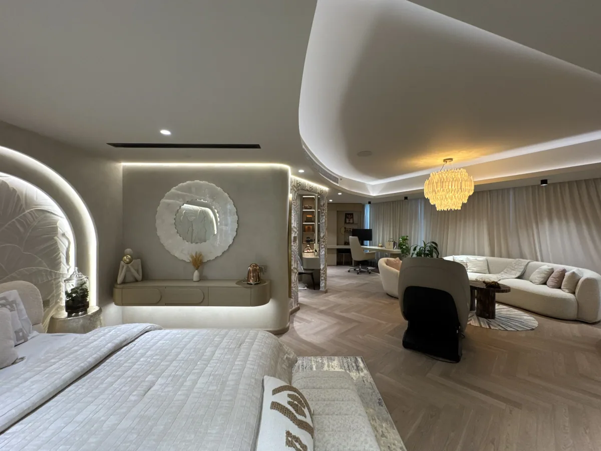 Master bedroom suite with herringbone parquet, curved cove ceiling and backlit headboard