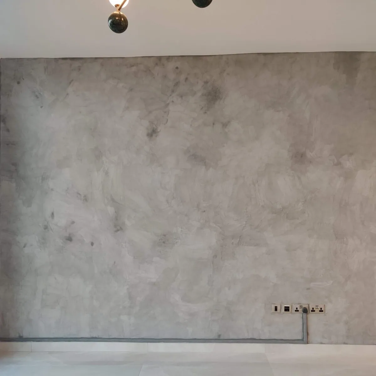 A Calm Continuous Surface - Study 98, a microcement overlay residential decorative finish in soft taupe